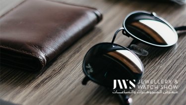 Black eyeglasses and brown wallet