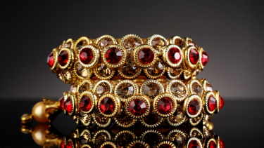 gold jewellery with red gems