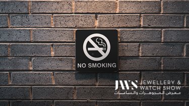 No smoking sign on a brick wall