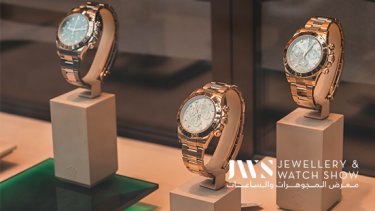 Three shining watches on display in an event