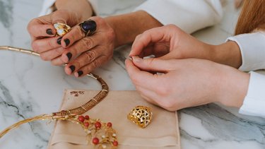 artist drafting jewellery design on paper