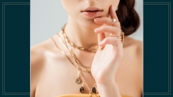 Woman wearing gold necklaces