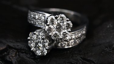diamond rings on a black fabric