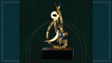 Ebda’a Awards trophy on a green background