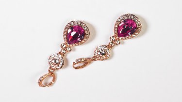 Gold earrings with viva magenta gems