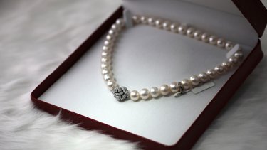 Pearl necklace in a red box