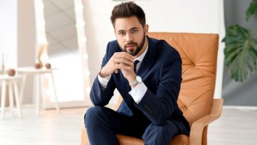 Stylish young man sitting