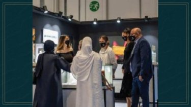 visitors checking jewellery display in the event