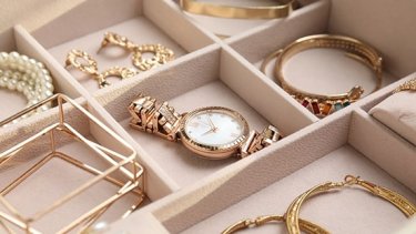 Watches and jewellery in a jewellery box