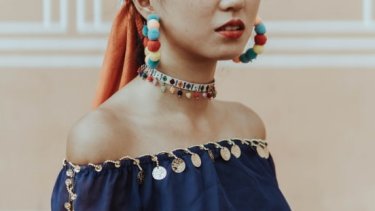 Woman wearing colourful jewellery