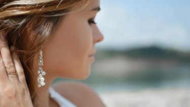 Woman wearing pearl earrings