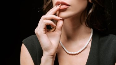 Woman wearing pearl necklace