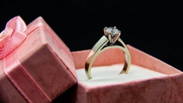diamond ring in a pink box