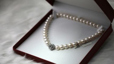 pearl necklace in a red box